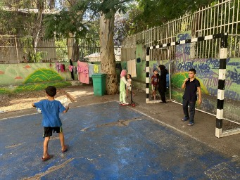 Displaced children enjoying in the school yard