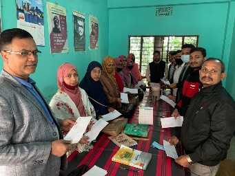 Our fundraised money being given to all the teachers and employees of the school.